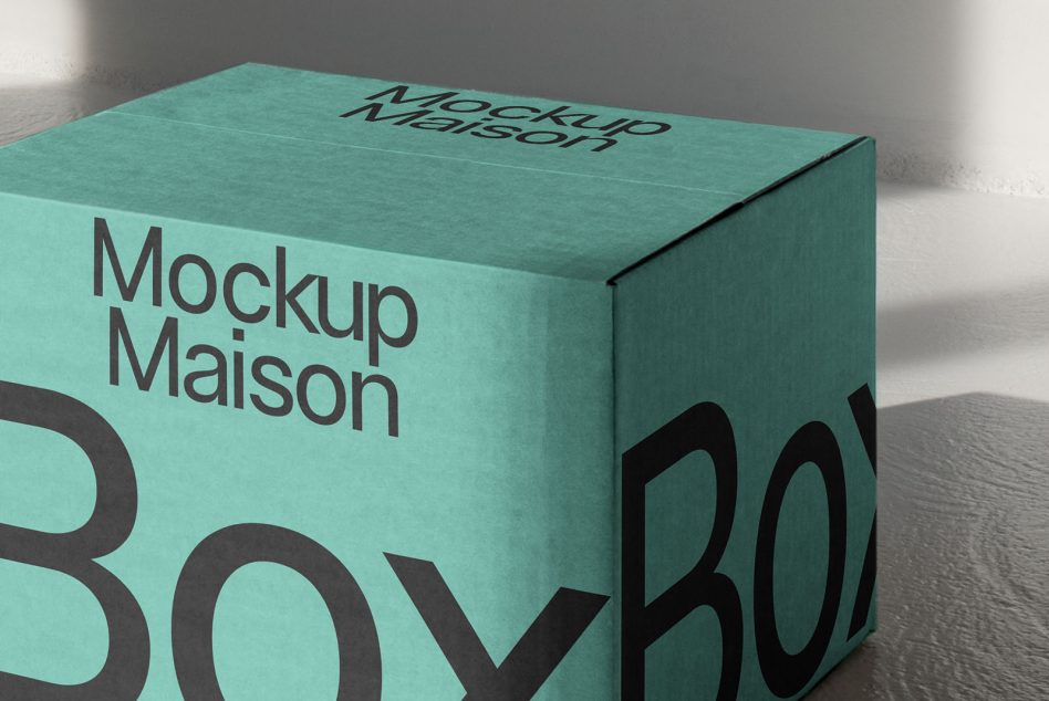 Close-up of turquoise rectangular box showing bold sans-serif lettering in black