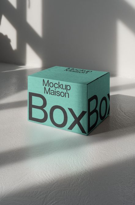 Mint green cube-shaped box mockup with large black letters on all visible sides