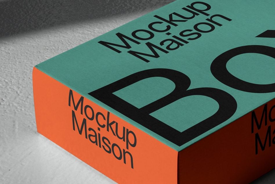 Angled box mockup showing turquoise orange color blocking with text detail