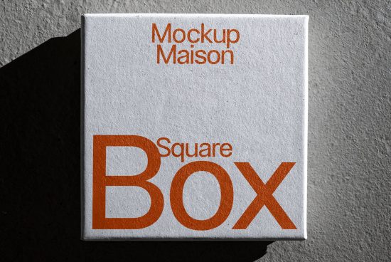 Square box packaging mockup with shadow, ideal for showcasing brand designs. Perfect for designers seeking quality mockups in presentations.