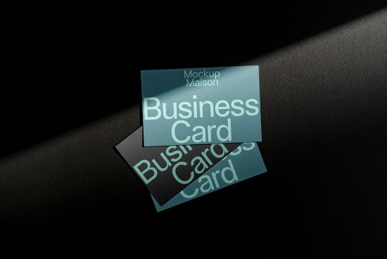 Elegant business card mockup with shadow overlay on dark background, showcasing front and back design for branding presentation.