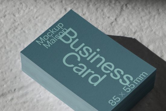 Stack of teal business card mockups with shadow on textured surface, design asset for branding presentation.