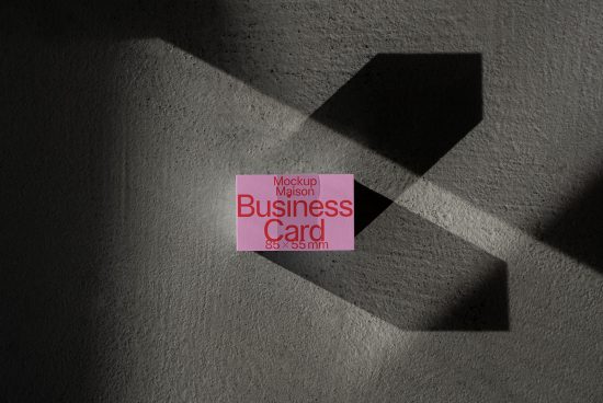 Business card mockup with dramatic shadows on textured surface, ideal for brand identity designs, Mockups category.