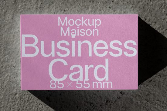 Pink business card mockup on textured background with editable design for graphic designers and print templates.