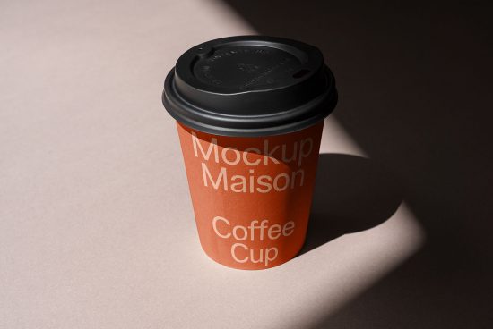 Realistic coffee cup mockup with shadow on beige background, perfect for branding presentations and packaging design for designers.