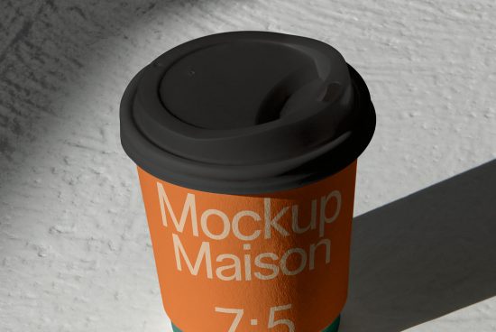 Realistic coffee cup mockup with editable design on textured background, perfect for presentations and branding projects for designers.