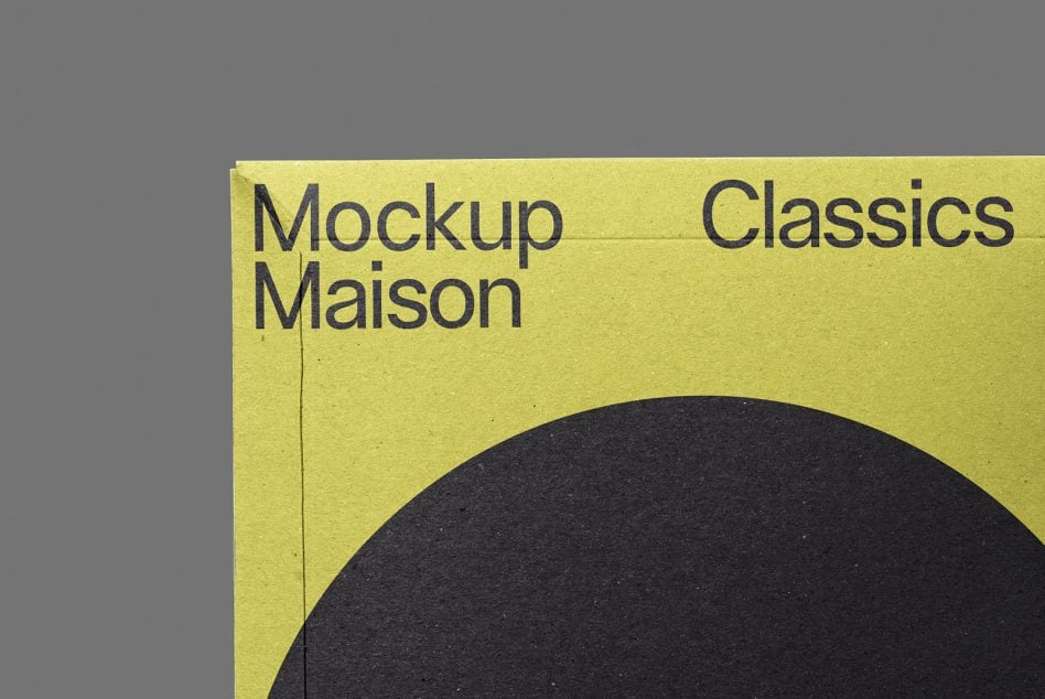 Close up of yellow mailer showing Mockup Maison Classics text with black circular shape