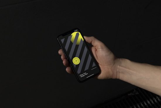 Hand holding smartphone with customizable screen mockup for app design presentation, against a dark background, digital asset for designers.