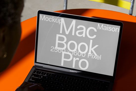 Laptop screen mockup on MacBook Pro with editable text displaying resolution specs, ideal for digital asset designers and template showcase.