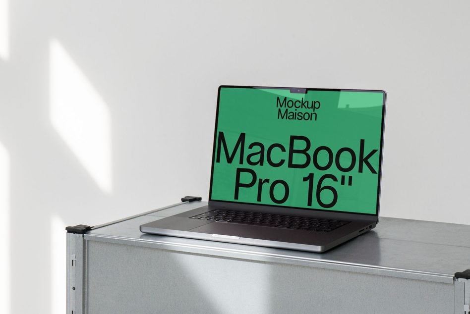 MacBook Pro 16 inch on metal shelf with green screen mockup