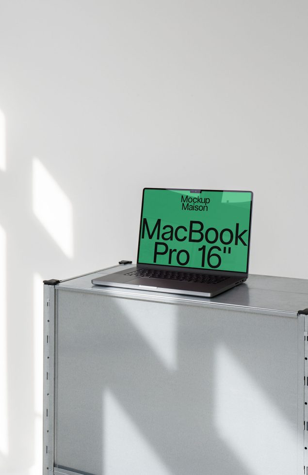 Laptop mockup on metal case in sunlight with shadow, showcasing MacBook Pro 16 display for digital design presentation.