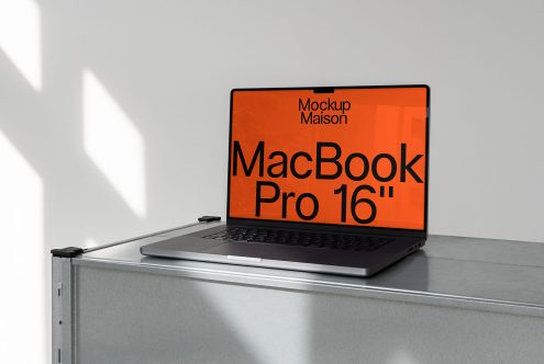 Laptop mockup on a grey desk with shadow overlay, MacBook Pro 16 inch screen display, realistic design presentation, digital mockup.