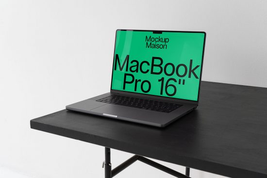 Laptop on desk with clear screen mockup for digital design presentation, sleek MacBook Pro 16 inch, modern workspace setup.