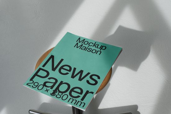 Realistic newspaper mockup on wooden stool with natural shadows, ideal for presentations and branding design in Templates category.