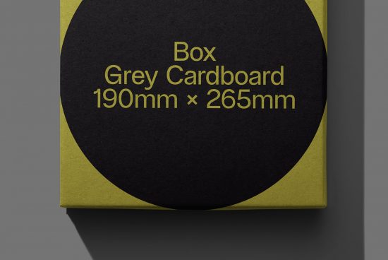 Mockup of a grey cardboard box with dimensions label in elegant gold font, ideal for packaging design presentations.