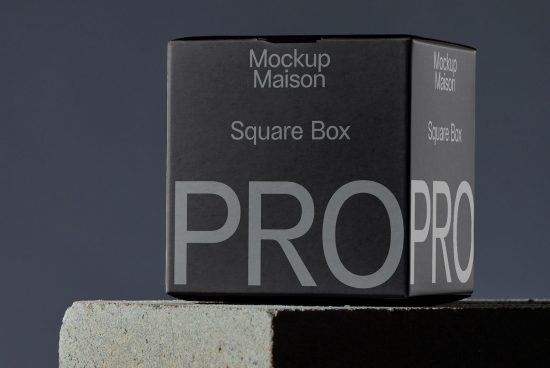 Professional square box mockup on dark background for packaging design showcase, available for download by graphic designers.