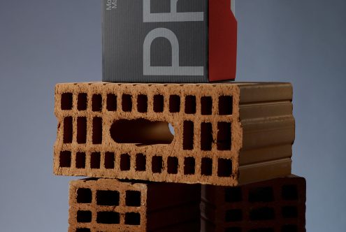 Creative packaging mockup design featuring stylish brick-shaped boxes stacked artistically, ideal for innovative product presentation.