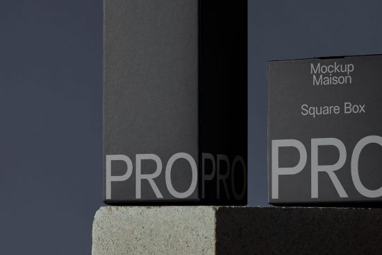 Elegant square box packaging mockup on a stone platform with contrasting light and shadow, ideal for product design presentation.