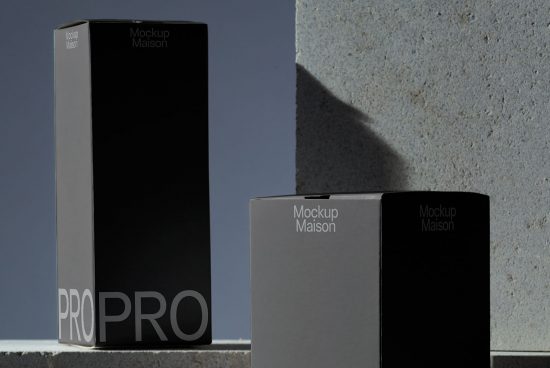 Elegant packaging mockup set with three boxes in black and grey showcasing brand design, perfect for presentations and portfolios.