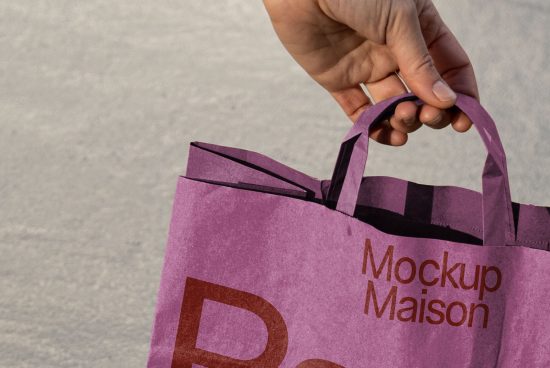 Purple shopping bag mockup in hand, ideal for branding designs, ecommerce packaging mockups, and retail marketing visuals.