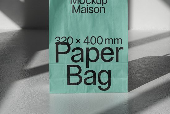 Green paper bag mockup with dimension labels casting a shadow on white surface, ideal for designers, packaging, branding presentations.