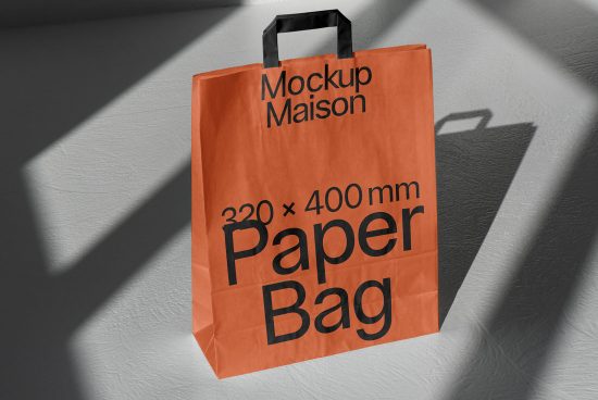 Orange paper bag mockup design with dimensions and Mockup Maison branding, displaying shadows on a textured background for graphic designers.