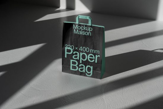 Black paper bag mockup on a sunlit surface with shadows, realistic texture, design presentation, 320x400mm dimensions for graphic designers.