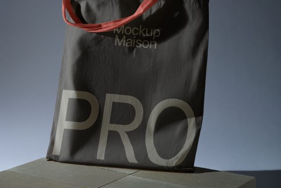 Stylish tote bag mockup with bold 'PRO' lettering, showcasing design for branding, presented on a clean background for graphic designers.