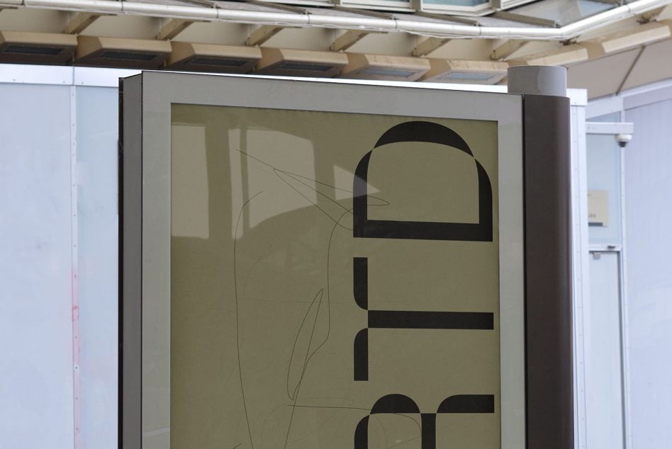Minimalist poster featuring bold letterforms stacked vertically with sketch elements