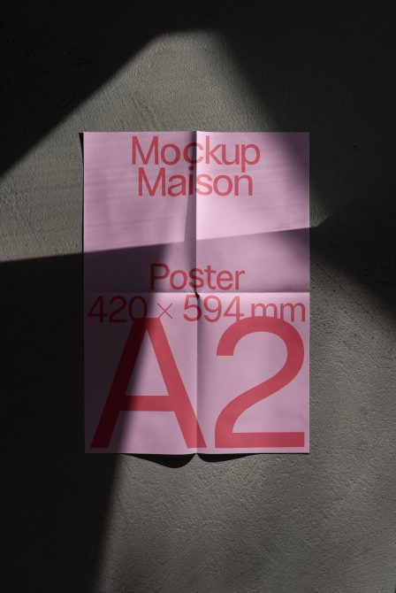 Pink A2 poster mockup with shadow overlay on concrete surface, design presentation tool for graphic designers and print templates.