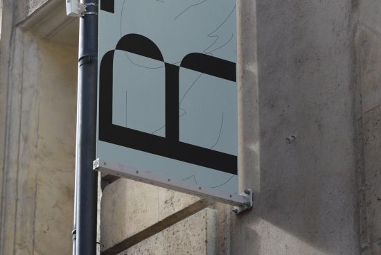 Urban signboard mockup attached to a pole, featuring minimalist black and white design, suitable for graphic presentations and branding.