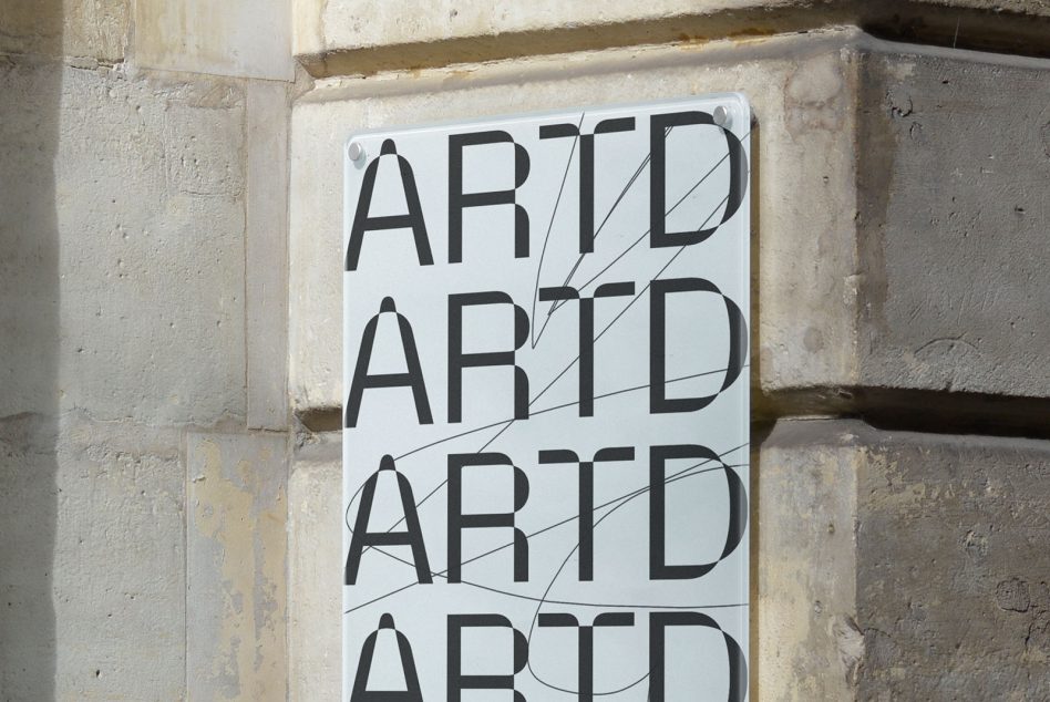 Street sign with repeated ARTD text overlaid with geometric line drawing