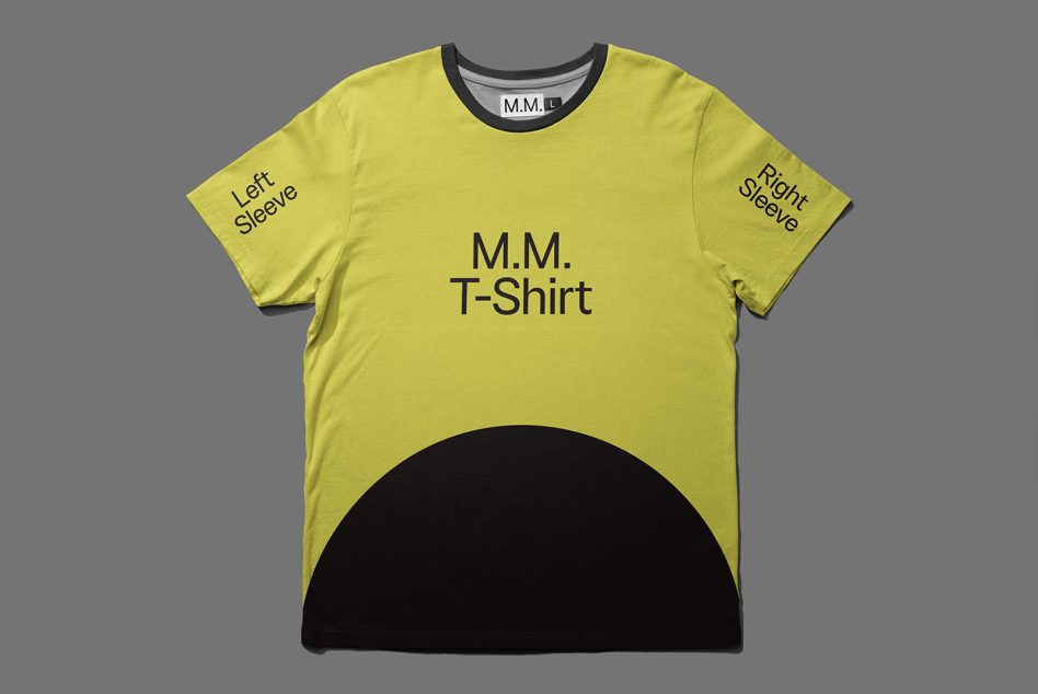 Flat lay of yellow tee with sleeve text labels both sides, black circle cutout