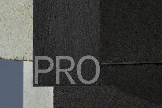 ALT: Close-up view of a sleek modern font design with the letters PRO etched in concrete, ideal for mockup, graphic design, and typography.