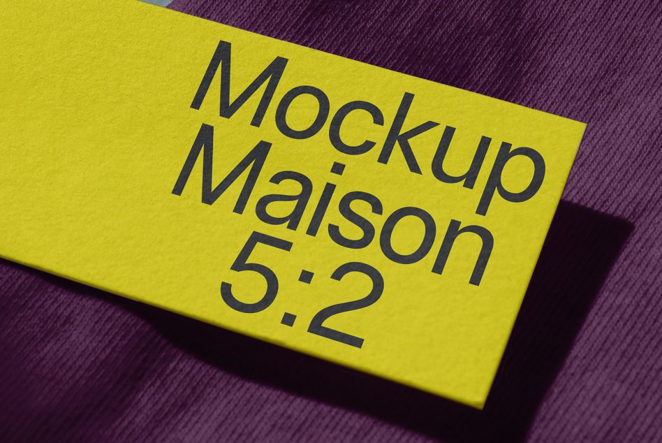 Bright yellow card with dark text angled on purple textured background