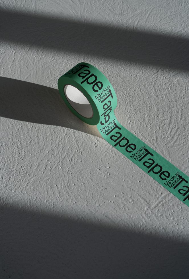 Green branded tape with shadow play on textured surface, showing mockup potential for packaging designs.