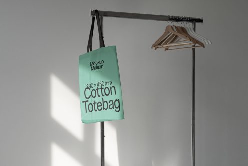 Tote bag mockup on stand with wooden hangers, modern design, minimalist style, branding showcase, designer asset for presentations