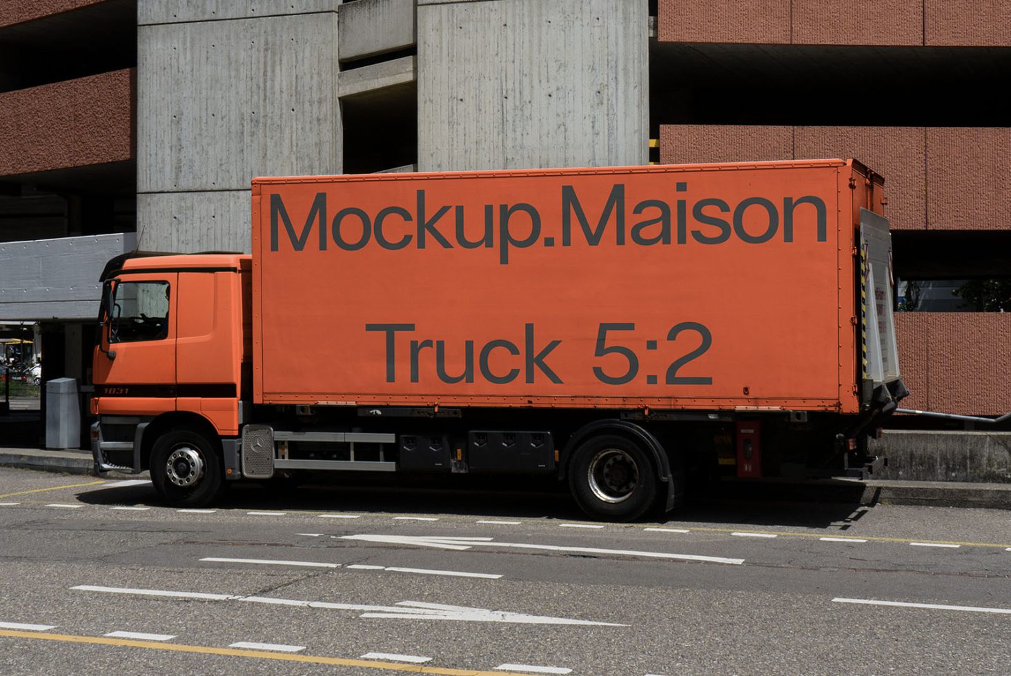 Orange delivery truck mockup with side view showcasing branding space, parked on urban street, ideal for vehicle wrap graphics designers.