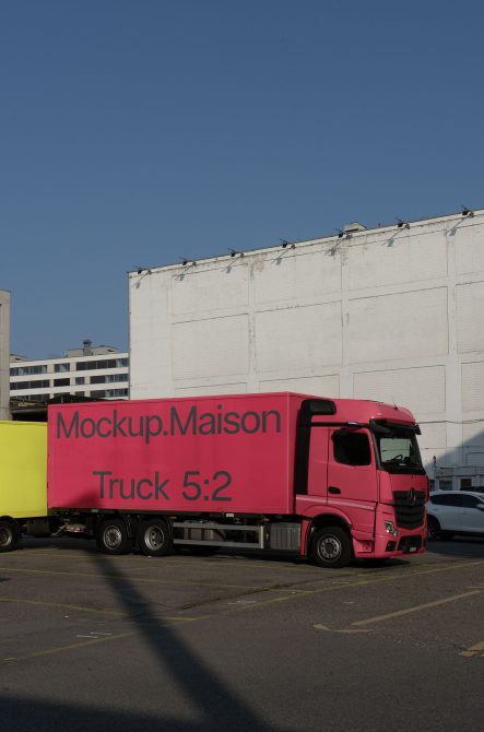 Bright pink delivery truck mockup in urban setting for transportation branding, great for designers creating vehicle graphics and wraps.