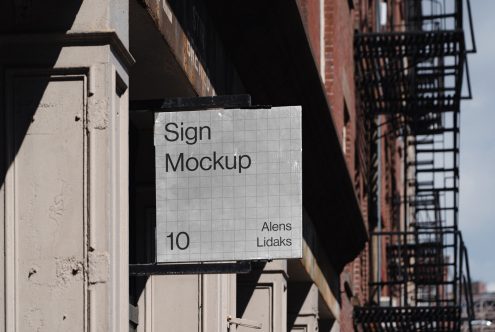 Urban exterior sign mockup hanging on a building facade with fire escape in the background, clear sky, realistic shadows, perfect for branding.