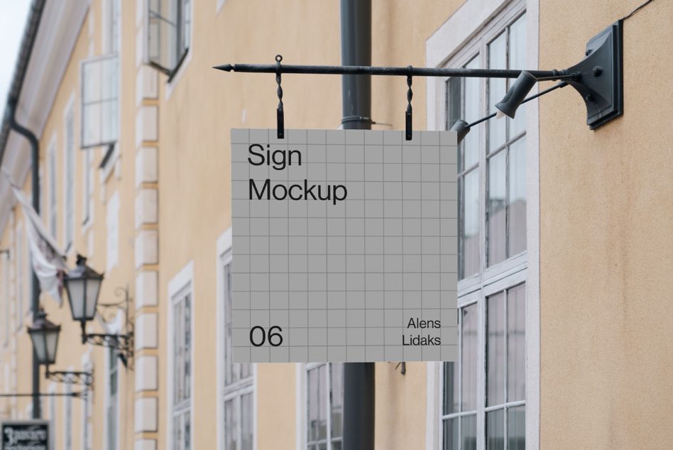 Outdoor hanging sign mockup in an urban setting, perfect for designers to display brand logos and signage designs.