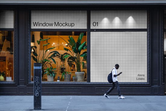 Urban storefront window mockup with editable display, passerby, and plants, suitable for designers to showcase branding.