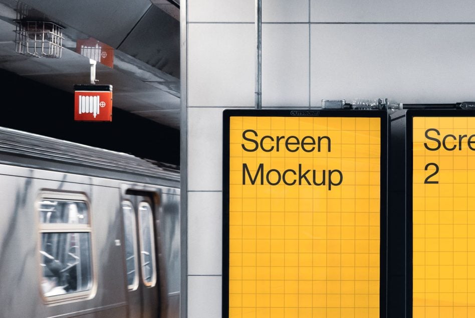 Yellow screen display in subway station with passing train car