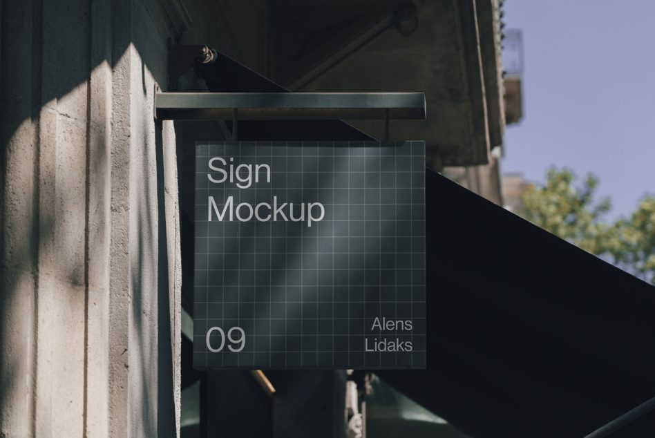 Outdoor sign mockup hanging on a building facade under sunlight, perfect for presenting branding projects and logo designs to clients.