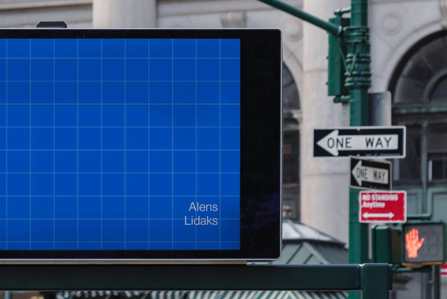 Blue grid mockup on digital billboard screen with urban background, useful for designers creating outdoor advertising content.