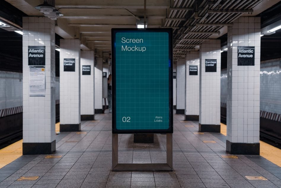 Digital display centered in subway platform with white tile walls