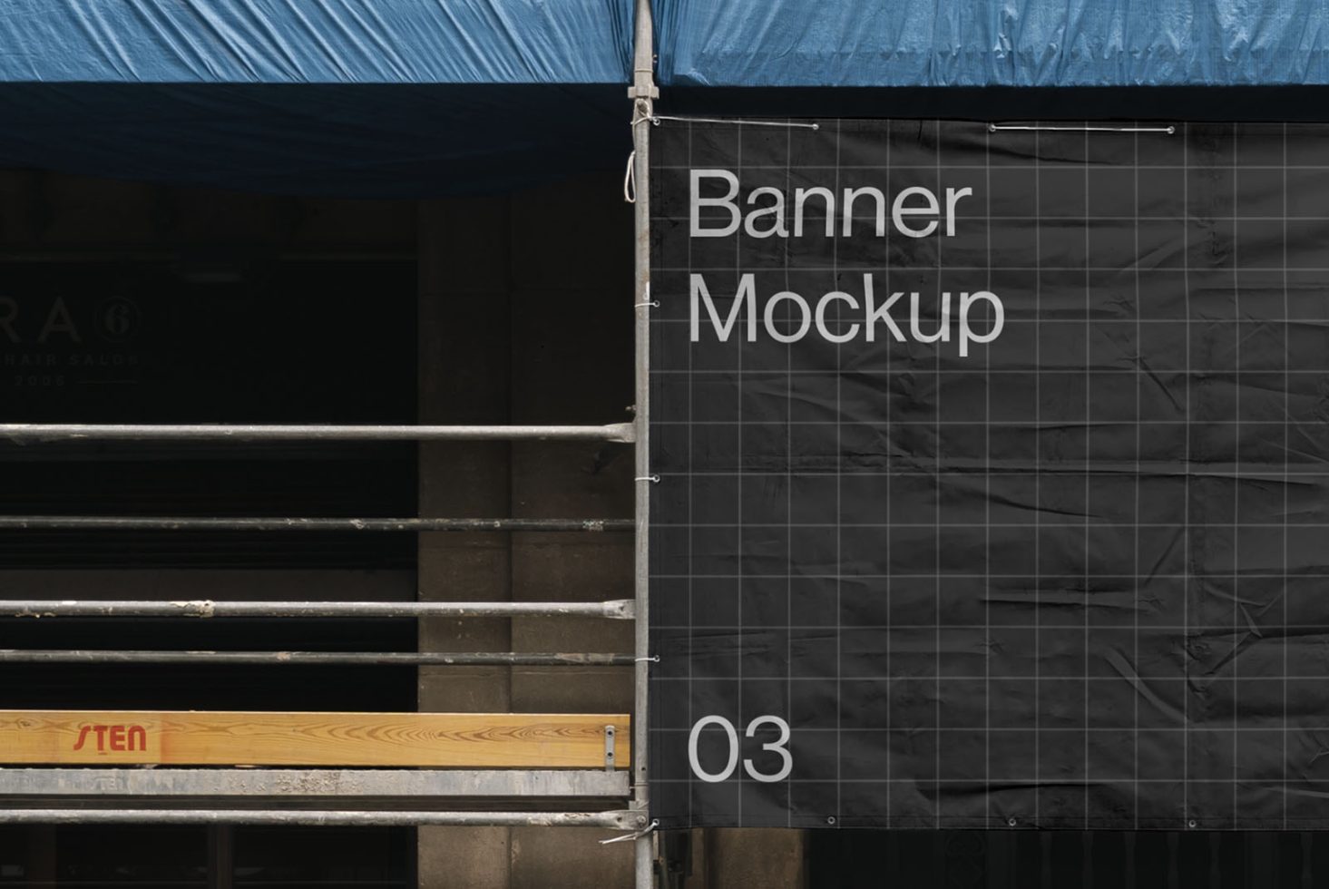 Outdoor urban banner mockup attached to scaffolding, versatile for designers to display ads or branding graphics.