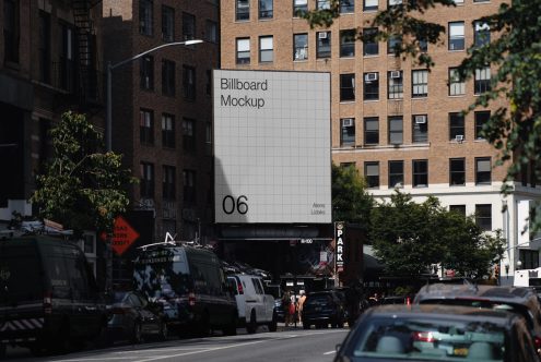 Urban billboard mockup on a building exterior in a busy city setting, ideal for realistic advertising presentations and design showcases.