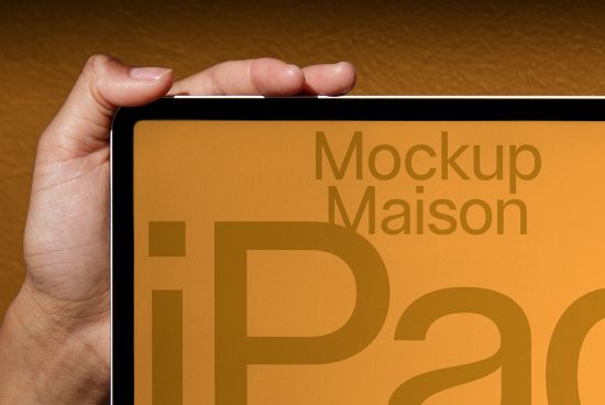 Person holding a tablet with a gold-colored mockup design, showcasing sleek digital asset for modern presentation.