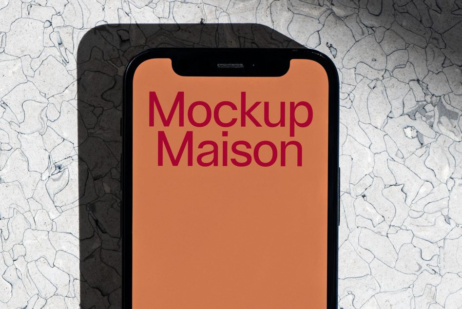 Smartphone mockup with marbled background for design presentation, digital device template on a textured surface, ideal for showcasing user interface.